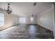 Spacious living room featuring neutral paint, decorative trim, wood-look flooring, and large windows at 6011 Placid Pass, Lakeland, FL 33805