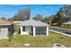 Newly constructed home with screened porch, grassy yard, and quiet street at 629 7Th W St, Lakeland, FL 33805