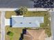 Overhead view of a house showing the roofline, yard, and a neighboring house at 629 7Th W St, Lakeland, FL 33805