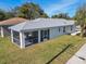 Aerial view of house, highlighting screened patio at 629 7Th W St, Lakeland, FL 33805