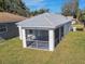 Aerial view of house with screened-in patio at 629 7Th W St, Lakeland, FL 33805