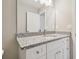 Modern bathroom with granite countertop and white cabinets at 629 7Th W St, Lakeland, FL 33805