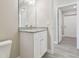 Modern bathroom vanity with granite countertop and white cabinets at 629 7Th W St, Lakeland, FL 33805