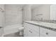 Updated bathroom with granite countertop and tiled shower/tub at 629 7Th W St, Lakeland, FL 33805