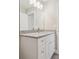 Modern bathroom vanity with granite countertop and white cabinets at 629 7Th W St, Lakeland, FL 33805