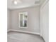 Charming bedroom with gray flooring and window at 629 7Th W St, Lakeland, FL 33805