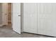 Large bedroom closet with double doors and built in shelving at 629 7Th W St, Lakeland, FL 33805