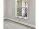 Bedroom with gray vinyl flooring, neutral walls, and a large window at 629 7Th W St, Lakeland, FL 33805