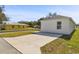 View of house from across the street, showing a concrete driveway at 629 7Th W St, Lakeland, FL 33805