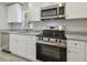 Modern kitchen with stainless steel appliances and granite countertops at 629 7Th W St, Lakeland, FL 33805