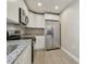 Modern kitchen featuring stainless steel appliances and granite countertops at 629 7Th W St, Lakeland, FL 33805