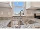 Stainless steel double sink with a modern gooseneck faucet at 629 7Th W St, Lakeland, FL 33805