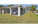 Enjoy the outdoors in this spacious screened porch at 629 7Th W St, Lakeland, FL 33805