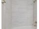 Clean shower with grey marble-look tiles at 629 7Th W St, Lakeland, FL 33805