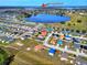 Aerial view of a residential neighborhood near a lake, featuring single-Gathering homes at 6610 Crescent Loop, Winter Haven, FL 33884
