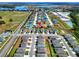 Aerial view of a residential neighborhood featuring single-Gathering homes, green spaces, and community amenities at 6610 Crescent Loop, Winter Haven, FL 33884