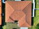 Aerial view of a home's roof showing its layout and design at 6610 Crescent Loop, Winter Haven, FL 33884