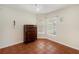 Bright bedroom with tile flooring, chest of drawers, and ample natural light at 6610 Crescent Loop, Winter Haven, FL 33884
