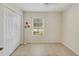 Cozy bedroom with neutral paint and tile flooring at 6610 Crescent Loop, Winter Haven, FL 33884