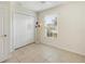 Bright bedroom featuring tile floors, ceiling fan and natural light from the window at 6610 Crescent Loop, Winter Haven, FL 33884