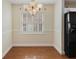Inviting dining area with hardwood floors, pendant lighting, and plenty of natural light at 6610 Crescent Loop, Winter Haven, FL 33884