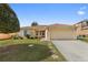 Charming single-story home with well-manicured lawn and inviting curb appeal at 6610 Crescent Loop, Winter Haven, FL 33884