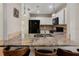 Modern kitchen showcasing granite countertops, stainless steel appliances, and bar seating at 6610 Crescent Loop, Winter Haven, FL 33884