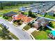 Street view of a well-maintained home featuring a driveway and front yard with mature landscaping at 6610 Crescent Loop, Winter Haven, FL 33884
