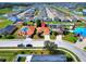 Street view of a well-maintained home featuring a driveway and front yard with mature landscaping at 6610 Crescent Loop, Winter Haven, FL 33884