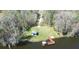 Aerial view showcasing lakefront recreational area with dock, gazebo, and ample green space at 6962 Starmount Dr, Lakeland, FL 33810