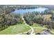 Aerial view showcasing the community's golf course, lake, and lush landscaping, perfect for active lifestyles at 6962 Starmount Dr, Lakeland, FL 33810