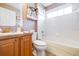 Bathroom featuring a tub with shower and vanity with a dark countertop at 6962 Starmount Dr, Lakeland, FL 33810