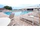 Community pool with lounge chairs and tables for relaxation and enjoyment at 6962 Starmount Dr, Lakeland, FL 33810