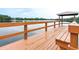 Community wooden dock with gazebo, offering peaceful waterfront views and seating at 6962 Starmount Dr, Lakeland, FL 33810
