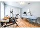 Bright exercise room with laminated floors, fan, and exercise equipment at 6962 Starmount Dr, Lakeland, FL 33810