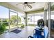 Lanai featuring concrete floors, fan, and a screen door at 6962 Starmount Dr, Lakeland, FL 33810