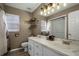 Updated bathroom with double vanity and a shower at 7026 Parliament Pl, Lakeland, FL 33809