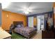 Bright bedroom with a full bed, ensuite bathroom, and plenty of closet space at 7026 Parliament Pl, Lakeland, FL 33809