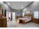 Spacious primary bedroom with wood flooring and a king-size bed at 7026 Parliament Pl, Lakeland, FL 33809