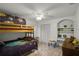 Bedroom with bunk beds, built-in shelving, and desk at 7026 Parliament Pl, Lakeland, FL 33809