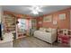 Charming bedroom with built-in window seat and twin bed at 7026 Parliament Pl, Lakeland, FL 33809