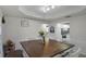 Dining area with wood table and access to kitchen at 7026 Parliament Pl, Lakeland, FL 33809