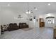 Spacious living room with tile floors and a view into the kitchen at 7026 Parliament Pl, Lakeland, FL 33809
