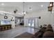 Living area with tile floors, access to the pool, and comfy seating at 7026 Parliament Pl, Lakeland, FL 33809