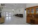 Spacious living room featuring tile floors, recessed lighting, and sliding glass doors to the pool area at 7026 Parliament Pl, Lakeland, FL 33809