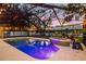 Inviting screened pool with spa and colorful plants at 7026 Parliament Pl, Lakeland, FL 33809