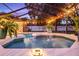 Tranquil pool and spa with fountain and night lighting at 7026 Parliament Pl, Lakeland, FL 33809