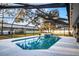 Inviting screened pool with a spa and plenty of surrounding space at 7026 Parliament Pl, Lakeland, FL 33809