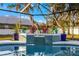 Beautiful spa with a tiled water feature and tropical plants at 7026 Parliament Pl, Lakeland, FL 33809