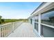 Spacious back deck with ample room for outdoor activities and scenic views of the surrounding landscape at 705 Lake Ada Blvd, Dundee, FL 33838